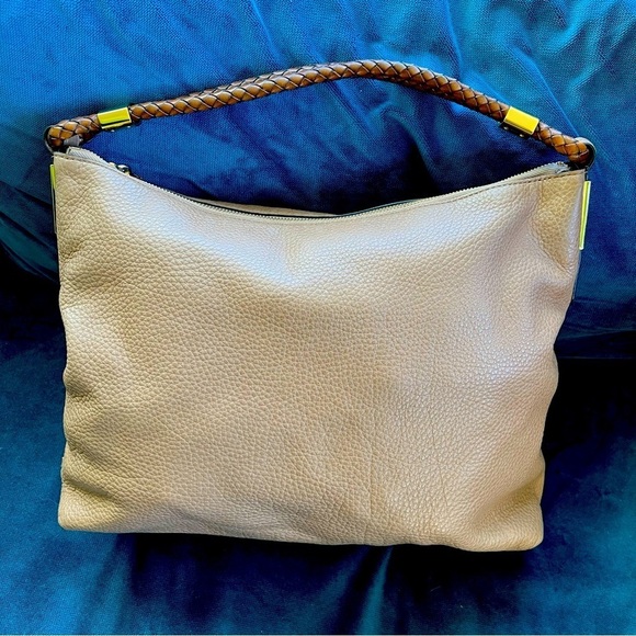 MICHAEL KORS COLLECTION
Skorpios Desert Tan Pebbled Leather Hobo
Bag $79… - Picture 2 of 16